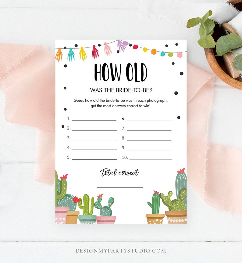 May include: A printable game card with a cactus theme. The card has the title "How Old" and asks players to guess the bride-to-be's age in each photo. The card has a colorful border with tassels and a total correct line at the bottom.