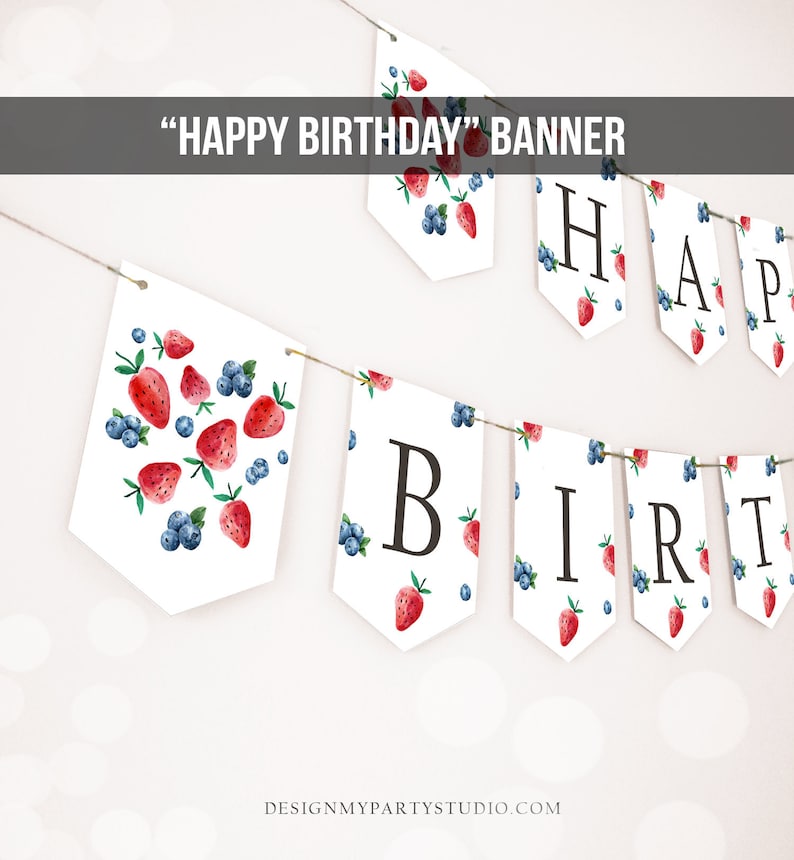 May include: A white banner with a strawberry and blueberry pattern. The banner says "Happy Birthday" in black letters.