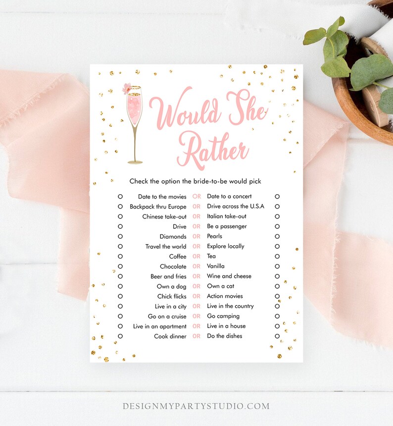 May include: A printable bridal shower game with the text "Would She Rather" in pink and gold. The game features a list of 14 questions with two options each, such as "Date to the movies or Date to a concert".