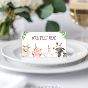 May include: A white card with green leaves and the text "YOUR TEXT HERE" in red. Four farm animals wearing party hats are pictured: a sheep, a pig, a goose, and a cow.