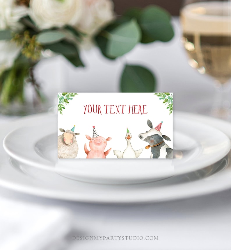 May include: A white card with green leaves and the text "YOUR TEXT HERE" in red. Four farm animals wearing party hats are pictured: a sheep, a pig, a goose, and a cow.