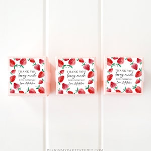 May include: Three small pink boxes with white lids and a strawberry pattern. Each box has a white ribbon and a thank you tag that reads "Thank you berry much for coming! Love, Madeline".
