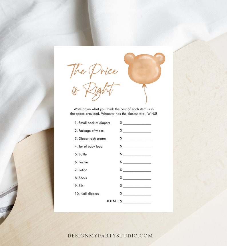 May include: A white baby shower game card with the text "The Price is Right" in elegant script. A light brown bear-shaped balloon graphic is in the upper right corner. The card lists baby items with spaces for prices.