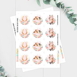 May include: Printable sheet of 12 round stickers featuring a pink floral design with a horseshoe, cowboy hat, and horse head. The stickers are perfect for party favors, gifts, or decorations.