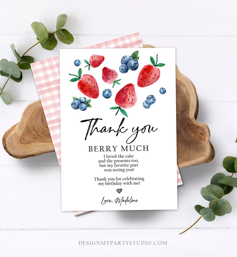 May include: A white thank you card with a watercolour illustration of strawberries and blueberries. The text reads "Thank you Berry Much. I loved the cake and the presents too, but my favourite part was seeing you! Thank you for celebrating my birthday with me! Love, Madeline."