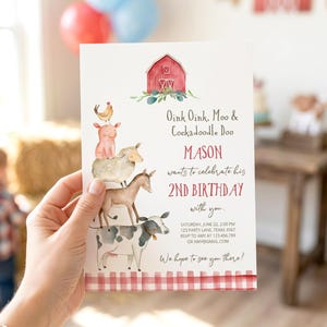 May include: A white birthday invitation card featuring a watercolor red barn and a stack of farm animals including a cow, donkey, sheep, pig, and chicken. The text reads: Oink Oink, Moo & Cockadoodle Doo, MASON wants to celebrate his 2ND BIRTHDAY with you.