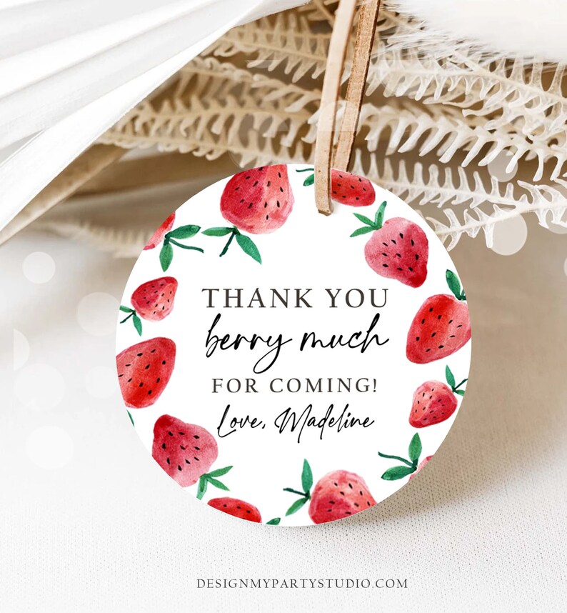 May include: Round white thank you tag with a red watercolor strawberry border. The tag says "Thank you berry much for coming! Love, Madeline".