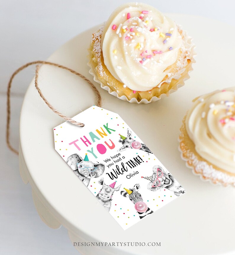 May include: Thank you tag with a white background and colourful polka dots. The tag features a cartoon illustration of animals wearing party hats. The text reads "Thank You" in colourful letters and "We hope you had a Wild Time!" with the name "Olivia" below.