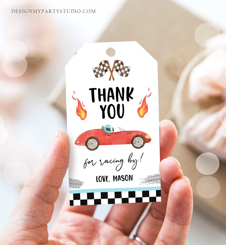 May include: Thank you for racing by!  A red race car with a checkered flag and flames on a white tag with black and white checkered border.  Love, Mason.