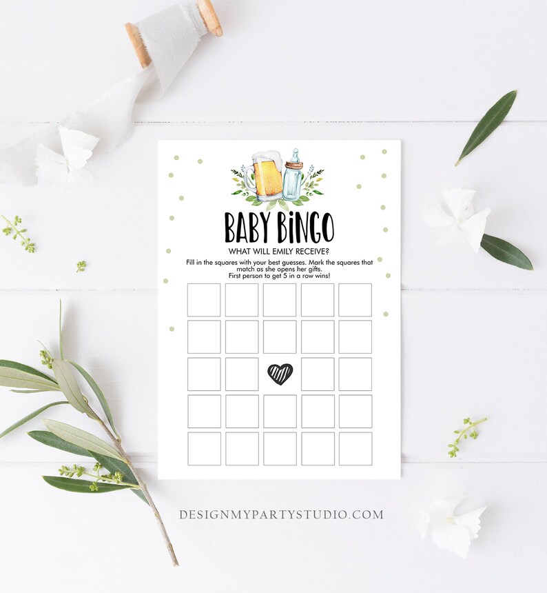 May include: A printable baby bingo card with a green and white polka dot background. The card has a title that says "Baby Bingo" and the text "What will Emily receive?" The card has 25 squares with a black and white striped heart in the center square.