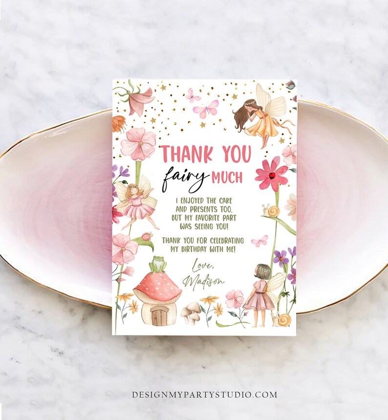 May include: Thank you card with a fairy theme. The card features a watercolor illustration of fairies, flowers, and a mushroom house. The text on the card reads "Thank you fairy much. I enjoyed the cake and presents too. But my favorite part was seeing you! Thank you for celebrating my birthday with me! Love, Madison."