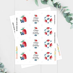 May include: Printable sticker sheet with eight round stickers featuring a watercolor illustration of strawberries and blueberries with the text "Happy Birthday".
