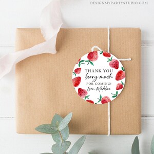 May include: Round white thank you tag with red watercolor strawberries and green leaves. The tag says "Thank you berry much for coming! Love, Madeline".