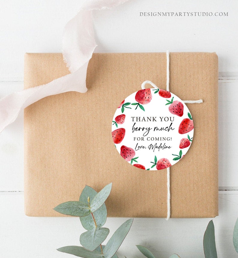 May include: Round white thank you tag with red watercolor strawberries and green leaves. The tag says "Thank you berry much for coming! Love, Madeline".