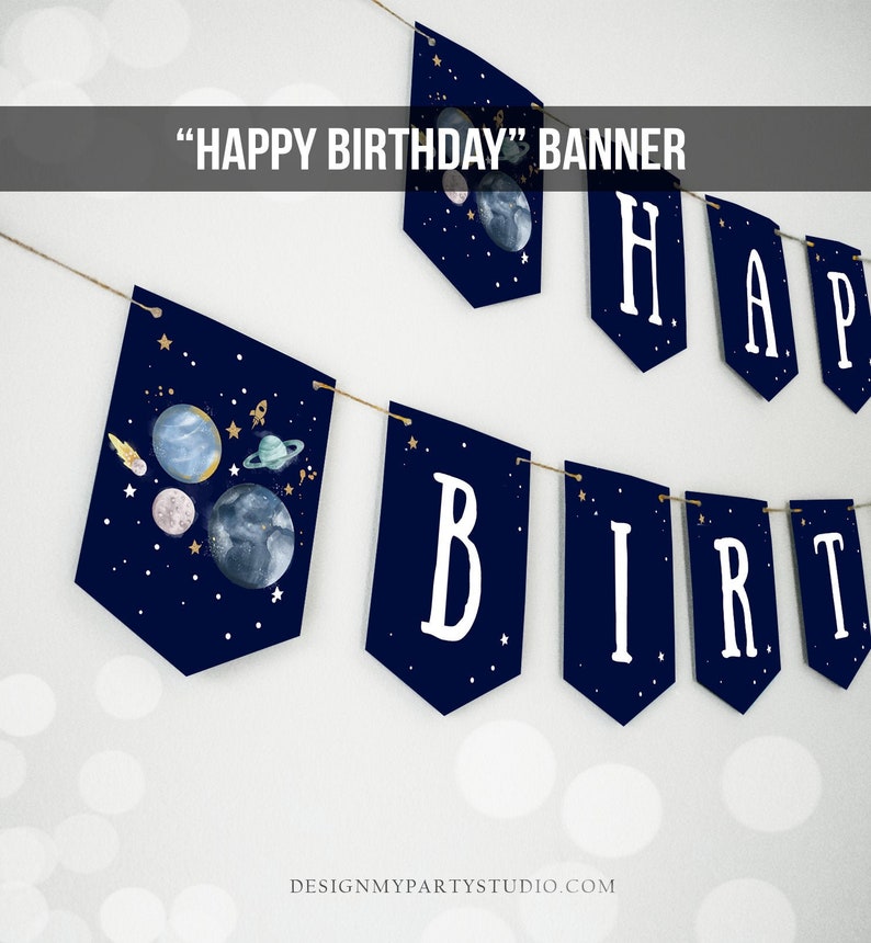 May include: A navy blue banner with white letters spelling "HAPPY BIRTHDAY" and a space-themed design featuring planets, stars, and a rocket ship.