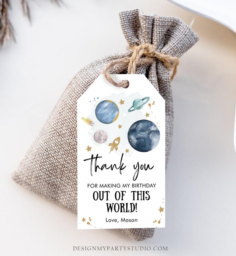 May include: A white thank you tag with a blue and green watercolor space theme. The tag says "Thank you for making my birthday out of this world! Love, Mason".
