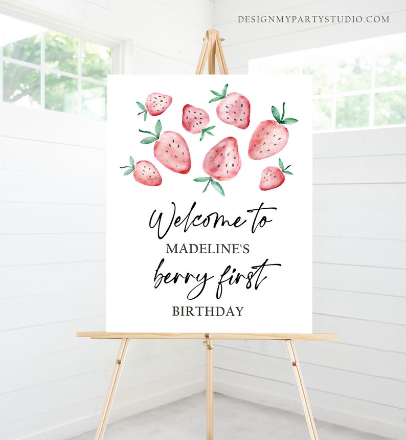 May include: Welcome to Madeline's Berry First Birthday sign with watercolor illustrations of strawberries on a white background.