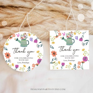 May include: Two thank you tags with a floral design and a watering can with flowers. The text on the tags reads "Thank you for celebrating with me! Love, Penelope".