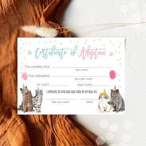May include: A printable certificate of adoption for a pet. The certificate has a pink and blue color scheme with confetti and paw prints. It includes spaces to fill in the adopter's name, the pet's name, fur color, eye color, and a signature line.