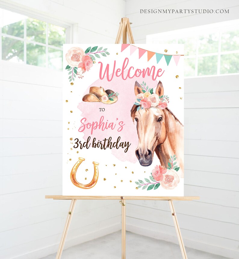 May include: Welcome to Sophia's 3rd birthday party sign with a watercolor illustration of a horse with a pink flower crown, a cowboy hat, and a horseshoe. The sign has a pink background with gold glitter.