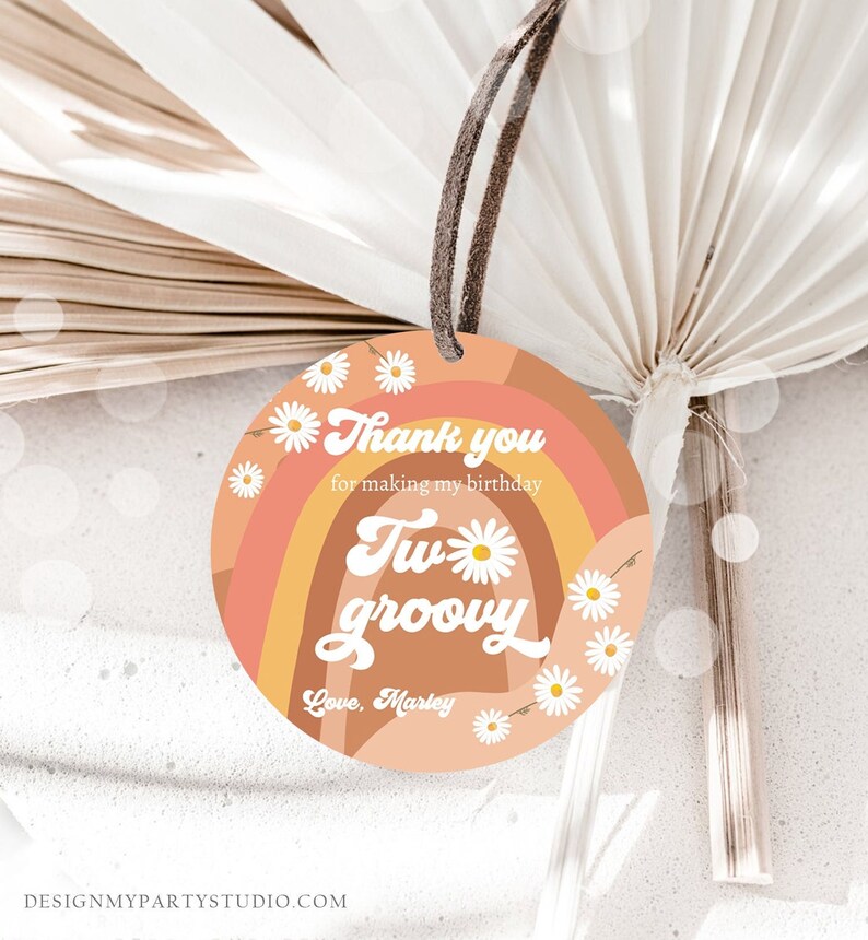 May include: A round, peach-colored thank you tag with a rainbow design and white daisies. The tag says "Thank you for making my birthday two groovy. Love, Marley."