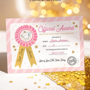 May include: A pink and white "Official Award" certificate from the Tooth Fairy Headquarters. The certificate features a pink ribbon with a tooth fairy illustration, gold stars, and gold ribbons that read "Tooth Fairy Award". The certificate is personalized with a name, age, and date.