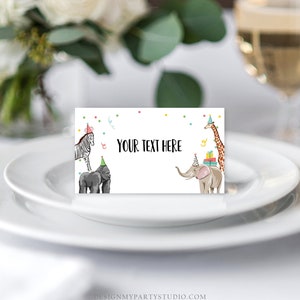 May include: A white place card with a colorful confetti border and a zebra, gorilla, elephant, and giraffe wearing party hats. The text "YOUR TEXT HERE" is in the center of the card.
