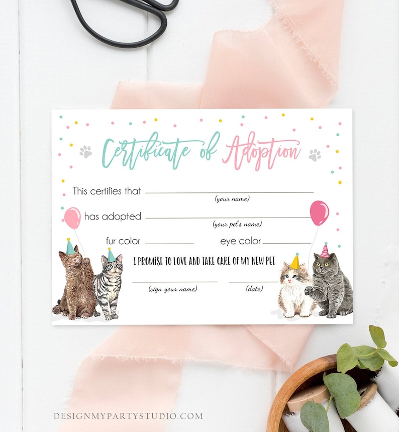 May include: A printable certificate of adoption for a new pet. The certificate has a pink and blue color scheme with confetti and a cartoon cat wearing a party hat. The text reads "Certificate of Adoption" and includes spaces to fill in the adopter's name, the pet's name, fur color, eye color, and the date of adoption.
