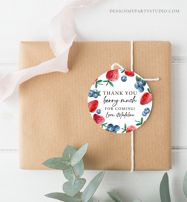 May include: Round thank you tag with a white background and a watercolour design of strawberries and blueberries. The text reads "Thank you berry much for coming! Love, Madeline".