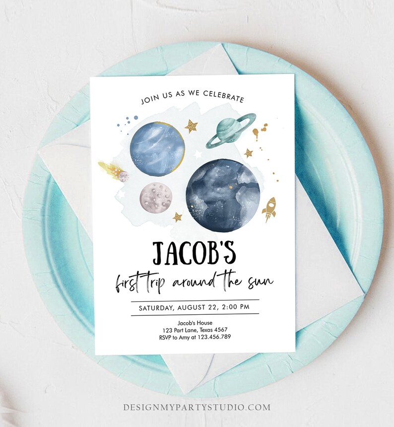 May include: A blue and white invitation with a watercolor illustration of planets and stars. The text reads "JOIN US AS WE CELEBRATE JACOB'S first trip around the sun SATURDAY, AUGUST 22, 2:00 PM Jacob's House 123 Part Lane, Texas 4567 RSVP to Amy at 123.456.789 DESIGNMYPARTYSTUDIO.COM"