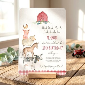 May include: A rectangular birthday invitation card featuring a watercolor illustration of a stack of farm animals including a cow, donkey, sheep, pig, and chicken beneath a red barn. The text reads Oink Oink, Moo & Cockadoodle Doo, MASON 2ND BIRTHDAY.