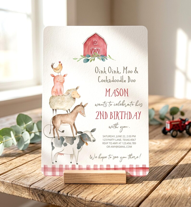 May include: A rectangular birthday invitation card featuring a watercolor illustration of a stack of farm animals including a cow, donkey, sheep, pig, and chicken beneath a red barn. The text reads Oink Oink, Moo & Cockadoodle Doo, MASON 2ND BIRTHDAY.