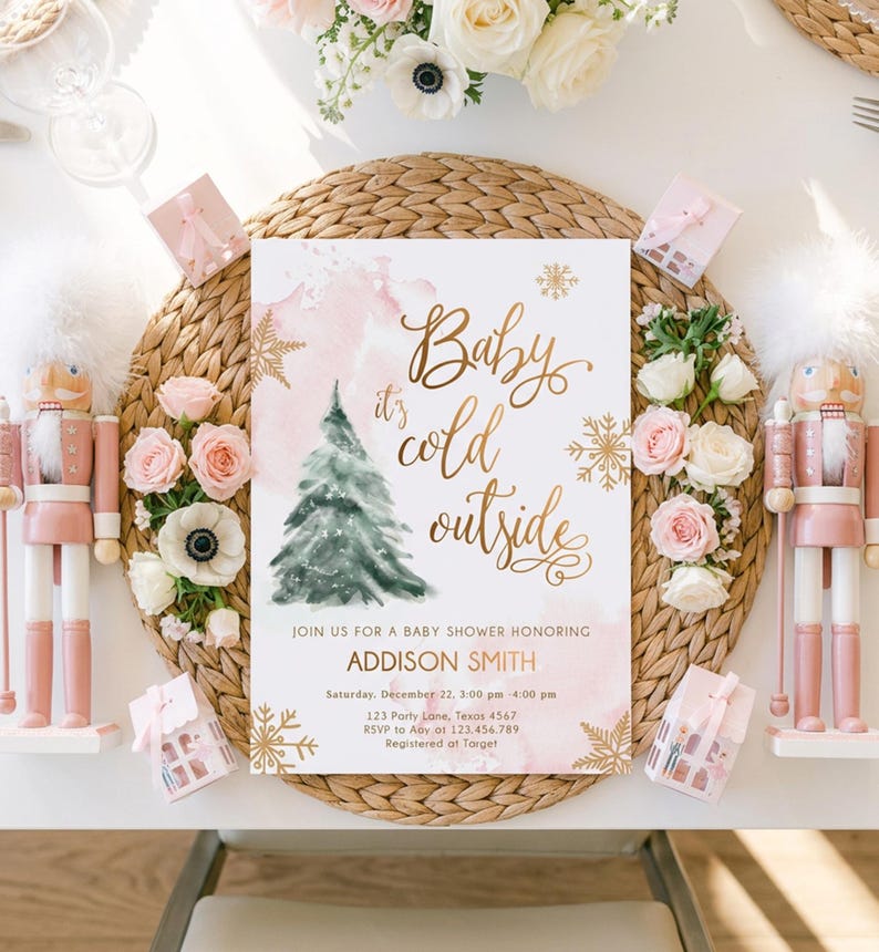 May include: A rectangular baby shower invitation card featuring a watercolour green Christmas tree, gold foil snowflakes, and the text Baby it's cold outside. The card includes details for Addison Smith on Saturday, December 22, at 123 Party Lane.