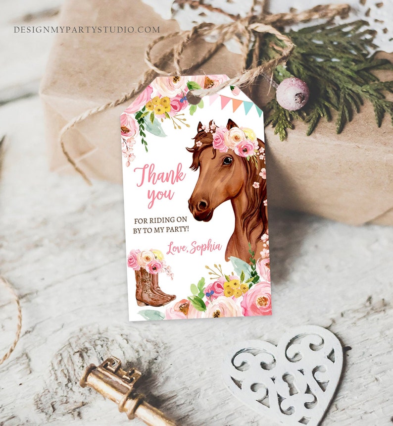 May include: Thank you for riding on by to my party! Love, Sophia. A pink and white horse party favor tag with a brown horse wearing a pink flower crown.