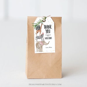May include: A white thank you tag with a stack of safari animals wearing party hats. The text on the tag reads "Thank You. We hope you had a wild time! Love, Olivia."