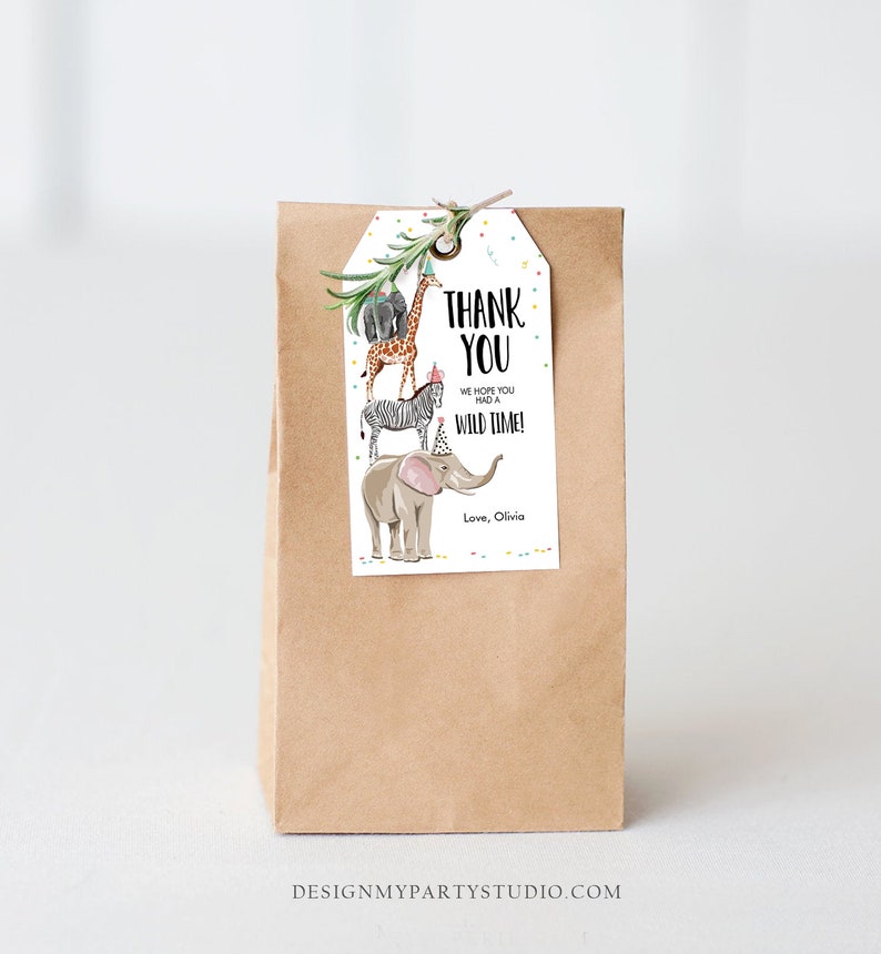 May include: A white thank you tag with a stack of safari animals wearing party hats. The text on the tag reads "Thank You. We hope you had a wild time! Love, Olivia."