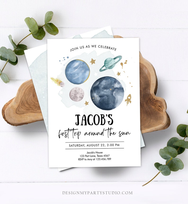 May include: A blue and white invitation with a watercolor illustration of planets and stars. The text reads "Join us as we celebrate Jacob's first trip around the sun. Saturday, August 22, 2:00 PM. Jacob's House, 123 Part Lane, Texas 4567. RSVP to Amy at 123.456.789."