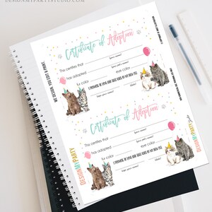 May include: Printable certificate of adoption for a cat. The certificate has a pink and blue color scheme with confetti and paw prints. It includes spaces to fill in the cat's name, fur color, eye color, and the adopter's name and signature.