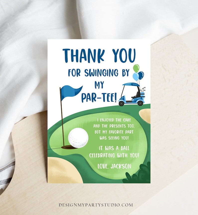 May include: A golf-themed thank you card with the text "THANK YOU FOR SWINGING BY MY PAR-TEE!". The card features a golf ball, flag, golf cart, and a green golf course design. The text "I enjoyed the cake and the presents too, but my favorite part was seeing you!" is also included.