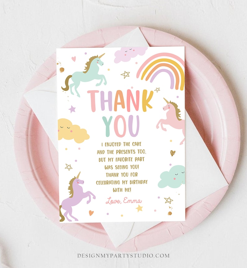 May include: Thank you card with a rainbow, clouds, and unicorns. The text reads "Thank You" and "I enjoyed the cake and the presents too, but my favorite part was seeing you! Thank you for celebrating my birthday with me! Love, Emma".