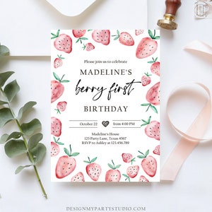 May include: A pink and green watercolor strawberry birthday invitation with the text "Madeline's Berry First Birthday" and details for the event. The invitation is decorated with a pattern of strawberries.