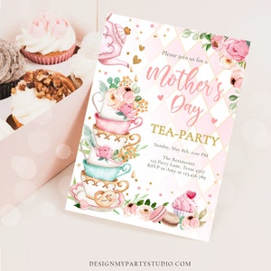 May include: A pink and gold invitation for a Mother's Day tea party. The invitation features a stack of teacups with floral designs and a teapot pouring tea. The text on the invitation reads "Please join us for a Mother's Day Tea-Party" and includes the date, time, location, and RSVP information.