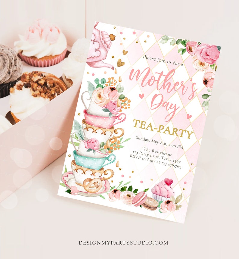 May include: A pink and gold invitation for a Mother's Day tea party. The invitation features a stack of teacups with floral designs and a teapot pouring tea. The text on the invitation reads "Please join us for a Mother's Day Tea-Party" and includes the date, time, location, and RSVP information.