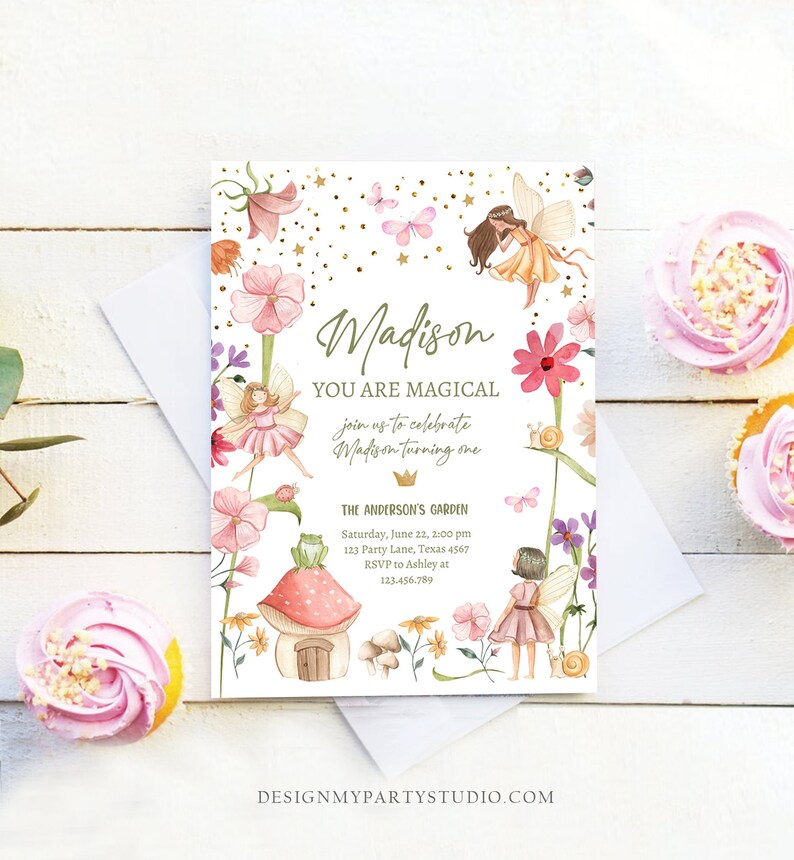 May include: A whimsical fairy-themed first birthday party invitation with a watercolor illustration of fairies, flowers, butterflies, and a mushroom house. The invitation reads "Madison You Are Magical join us to celebrate Madison turning one The Anderson's Garden Saturday, June 22, 2:00 pm 123 Party Lane, Texas 4567 RSVP to Ashley at 123-456-789".