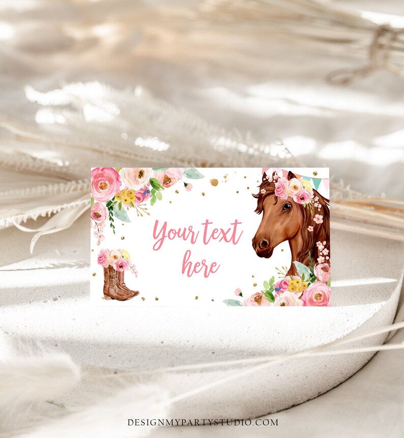 May include: Printable party favour tag featuring a brown horse wearing a pink floral crown, pink cowboy boots, and pink flowers. The tag has a white background with gold glitter and the text "Your text here".
