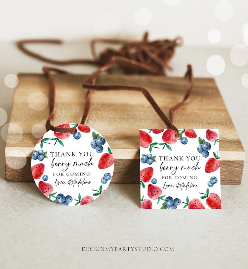 May include: Two round and square thank you tags with a watercolour design of strawberries and blueberries. The text on the tags reads "Thank you berry much for coming! Love, Madeline".