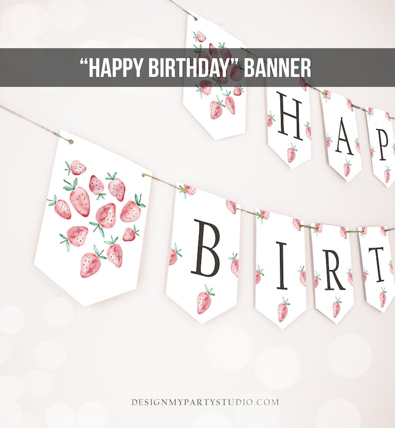 May include: A white banner with the words "HAPPY BIRTHDAY" in black letters. The banner is decorated with pink and green strawberries.
