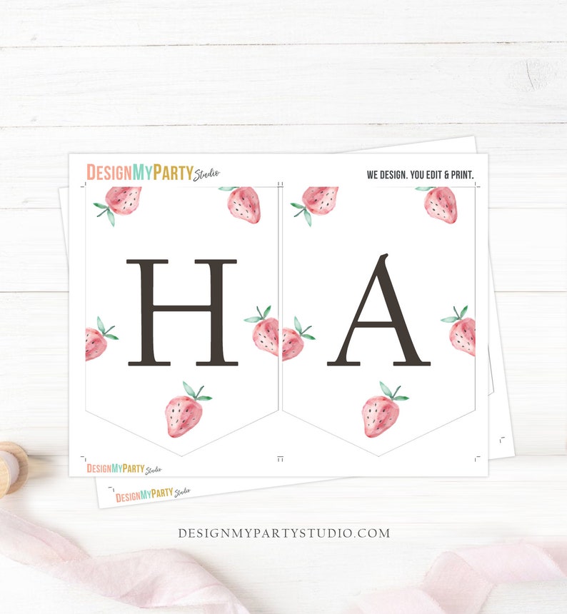 May include: Printable banner with the letters "HA" in black, decorated with pink watercolor strawberries. The banner is designed for a party and includes the text "WE DESIGN. YOU EDIT & PRINT." and the website "DESIGNMYPARTYSTUDIO.COM".
