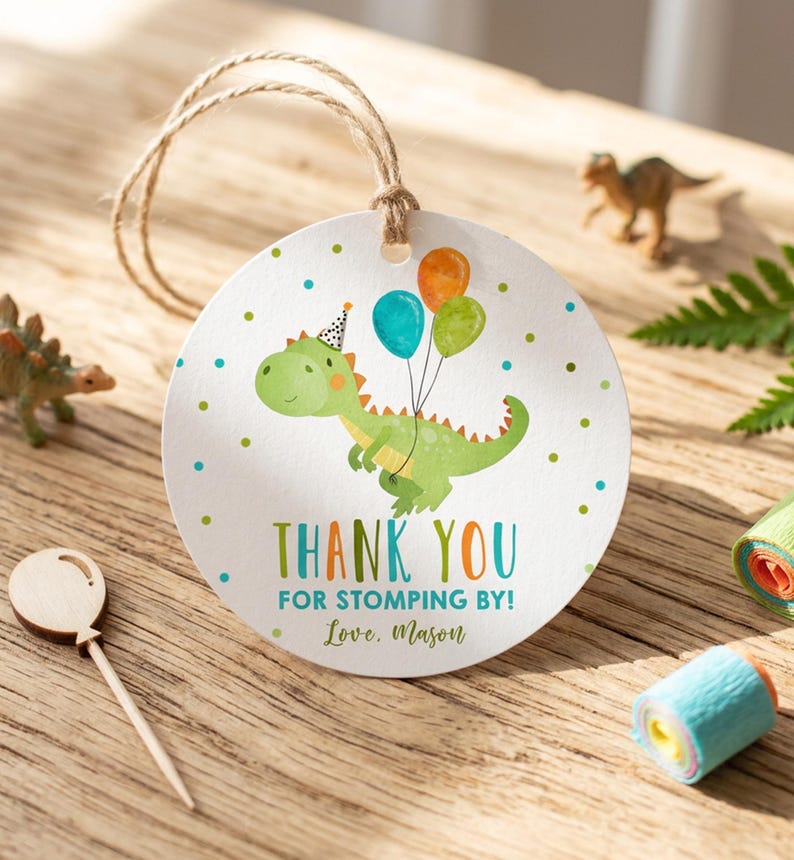 Editable dinosaur favor tag with T-Rex illustration in green and brown tones, featuring customizable thank you text for a boy's prehistoric birthday party, shown in square and round formats.