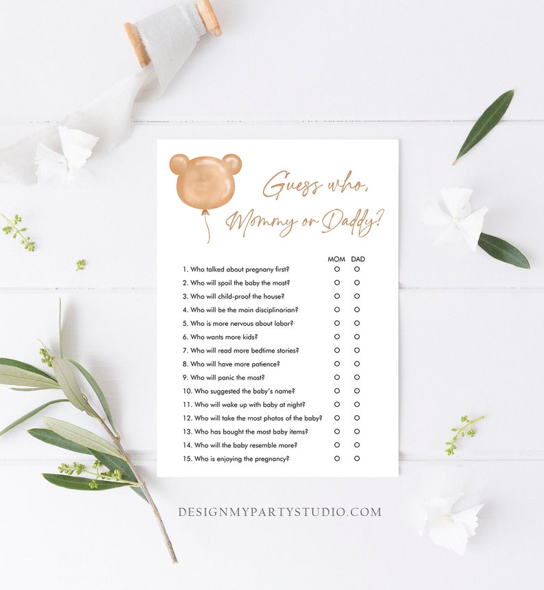 May include: A printable game card with a brown bear balloon illustration and the text "Guess who, Mommy or Daddy?"  The game features 15 questions about pregnancy and parenting, with checkboxes for "Mom" and "Dad" for each question.